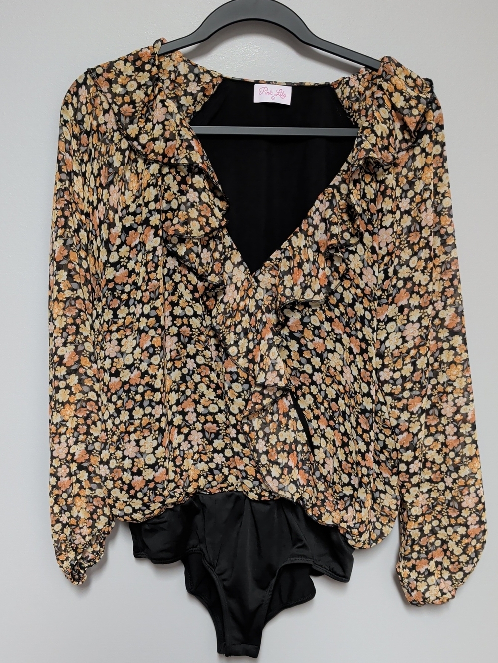 Pink Lily Black Floral Ruffle Wrap Bodysuit